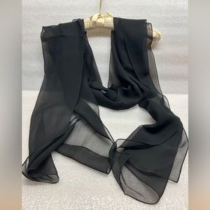 Lady’s elegant black sheer wrap